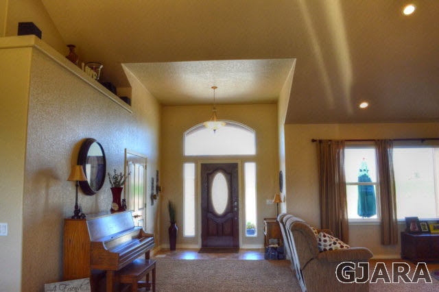 1575 15 Road Loma, CO 81524 - Photo 3 of 30 a living room with furniture and a chandelier