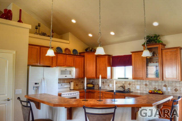 1575 15 Road Loma, CO 81524 - Photo 6 of 30 a kitchen with stainless steel appliances granite countertop a lot of counter space and a sink