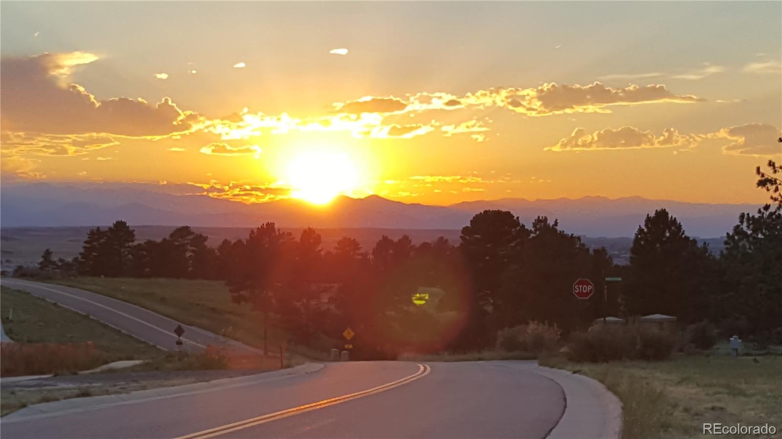 7921 Forest Keep Circle Parker, CO 80134 - Photo 19 of 36 a view of a street with sunset view