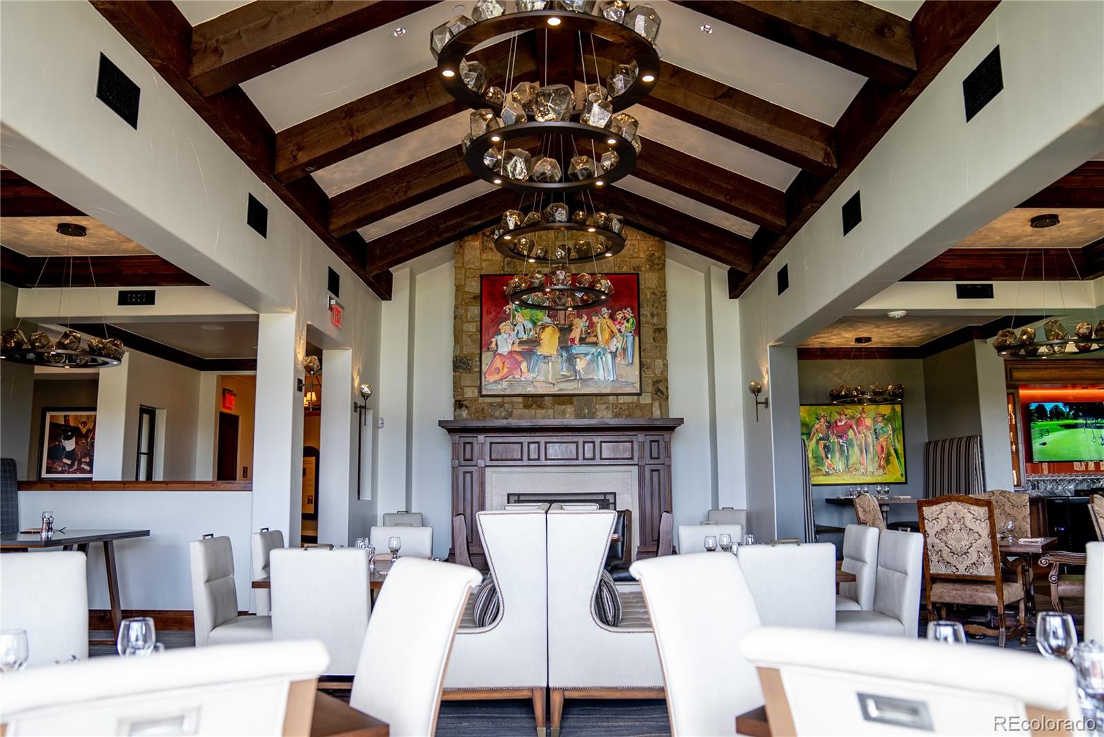 7921 Forest Keep Circle Parker, CO 80134 - Photo 28 of 36 a living room with furniture a fireplace and a flat screen tv