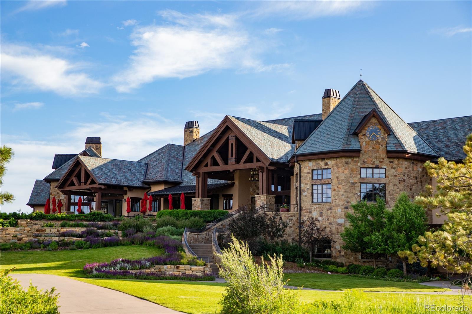 7921 Forest Keep Circle Parker, CO 80134 - Photo 10 of 36 a front view of a house with swimming pool having outdoor seating