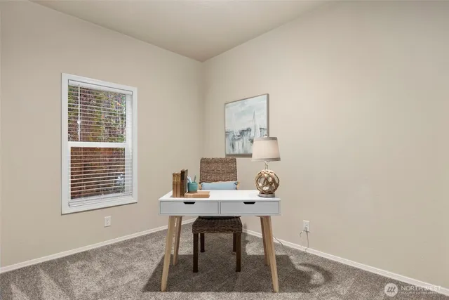 a workspace with furniture and window