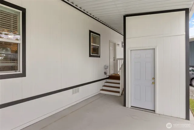 a view of a hallway with staircase