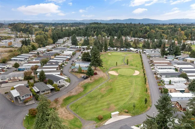 an aerial view of a house with a swimming pool