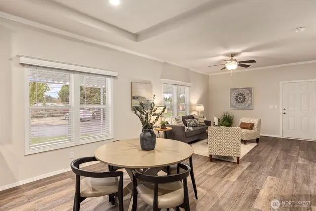 a view of a dining room with furniture and wooden floor