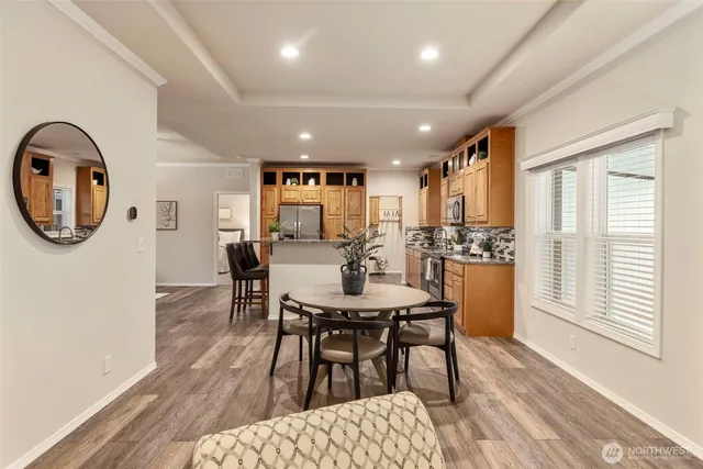a view of a dining room with furniture and a window