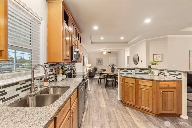 a kitchen with a sink stove and cabinets