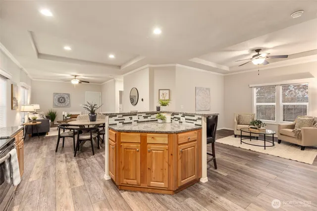 a large kitchen with a table and chairs in it