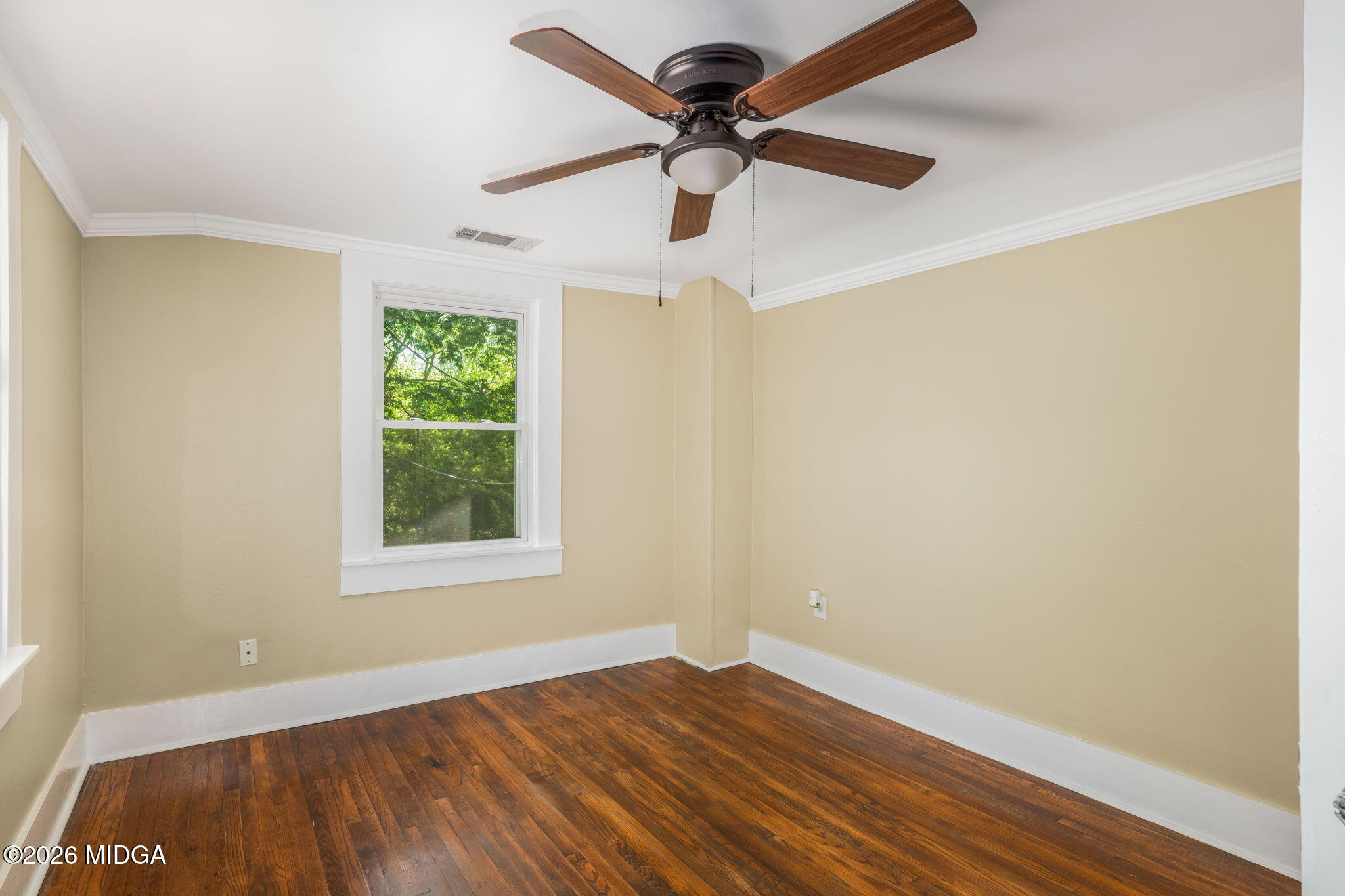 107 Childs Street Gray, GA 31032 - Photo 22 of 37 an empty room with a window and a ceiling fan