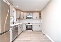 13 Showell Pond Road Sandown, NH 03873 - Photo 11 of 42 a kitchen with a sink cabinets and stainless steel appliances