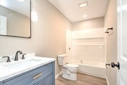 13 Showell Pond Road Sandown, NH 03873 - Photo 18 of 42 a bathroom with a granite countertop sink toilet and shower