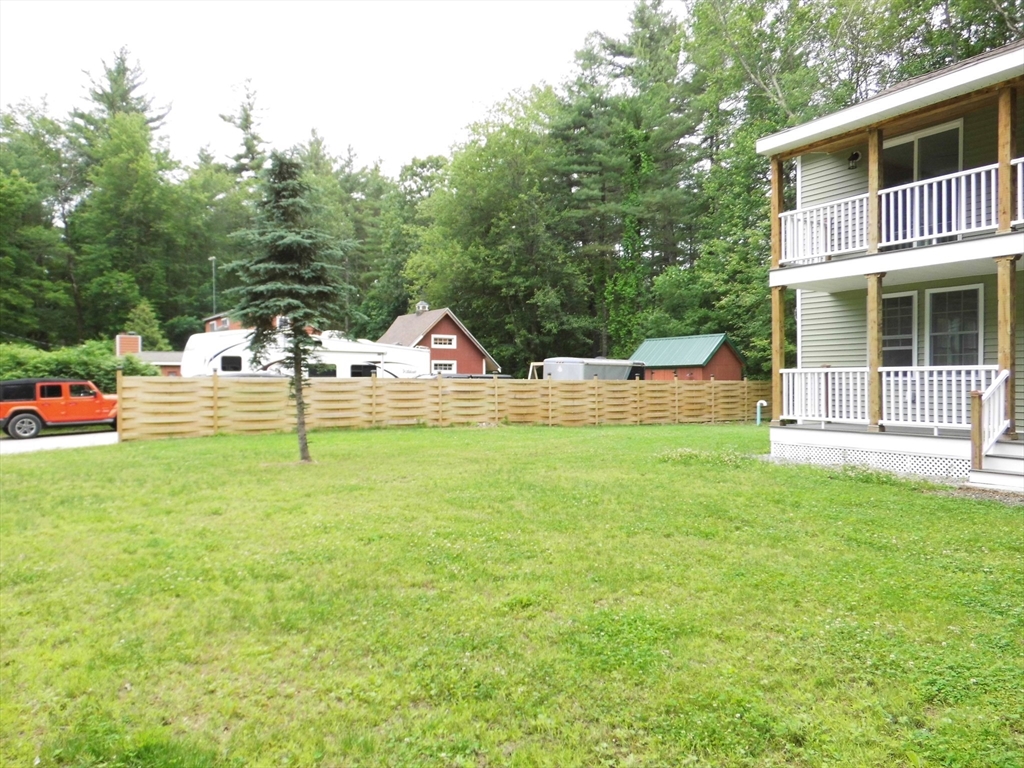 13 Showell Pond Road Sandown, NH 03873 - Photo 2 of 42 a view of a house with backyard and a tree