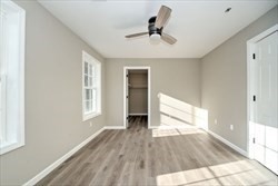 13 Showell Pond Road Sandown, NH 03873 - Photo 26 of 42 a view of empty room with wooden floor and fan