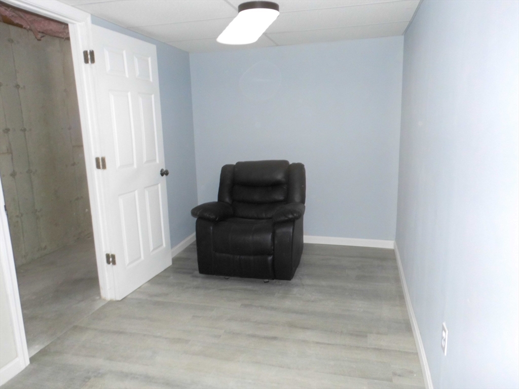 13 Showell Pond Road Sandown, NH 03873 - Photo 32 of 42 an empty room with furniture and wooden floor