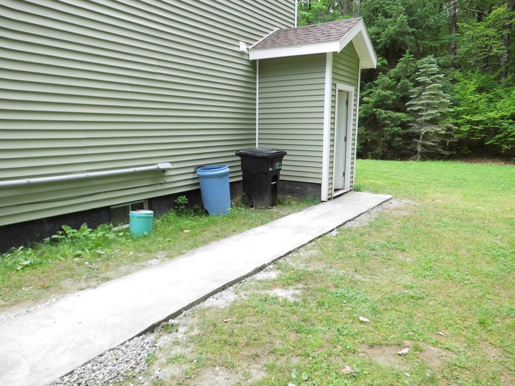 13 Showell Pond Road Sandown, NH 03873 - Photo 40 of 42 a view of a house with backyard and a yard
