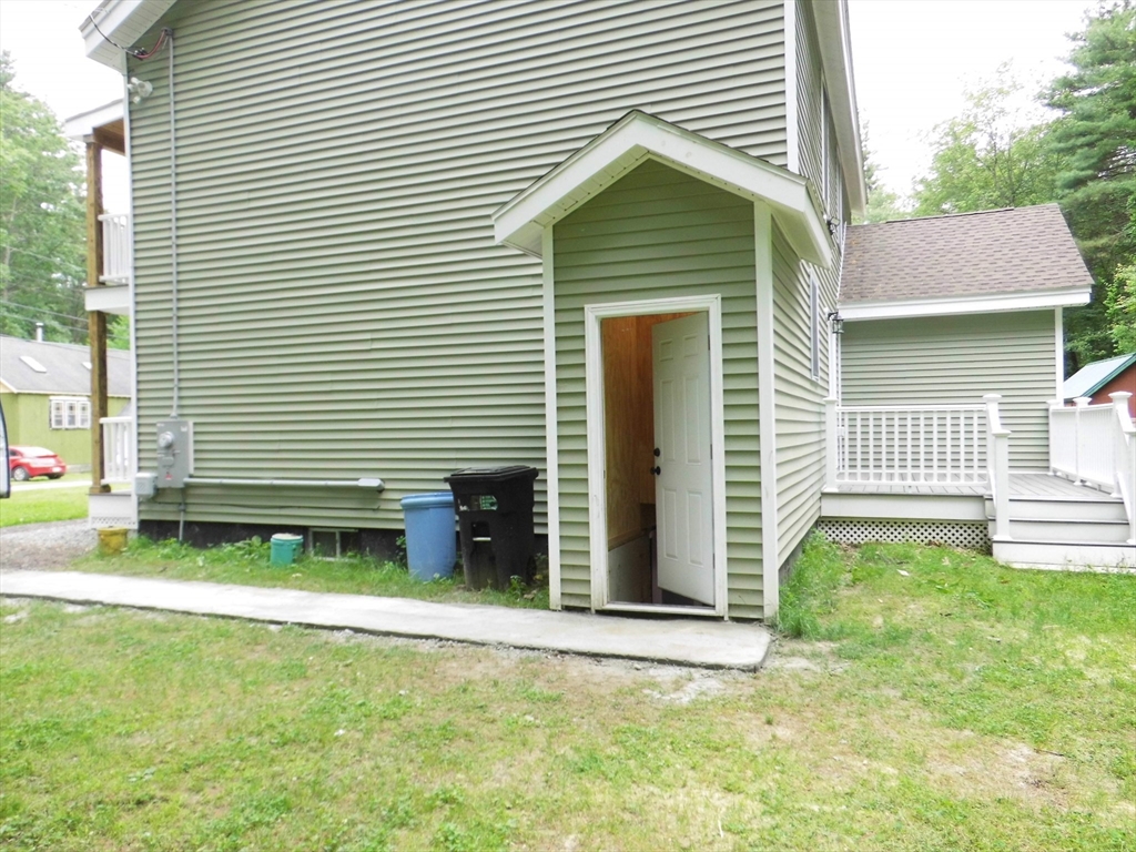 13 Showell Pond Road Sandown, NH 03873 - Photo 41 of 42 a front view of a house with a yard