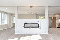 13 Showell Pond Road Sandown, NH 03873 - Photo 8 of 42 a kitchen with a refrigerator and a oven