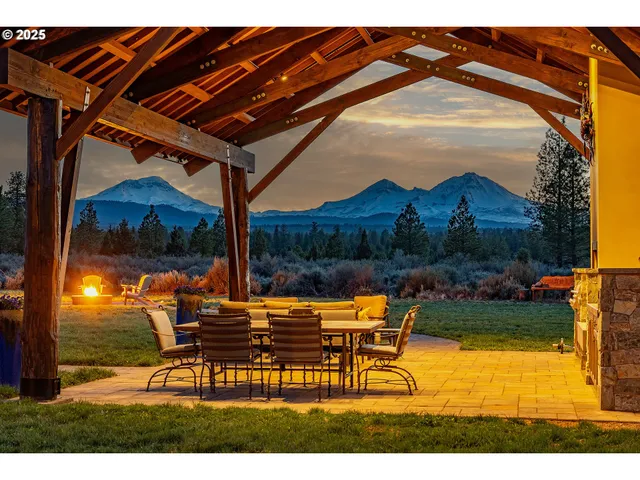 a backyard of a house with outdoor seating