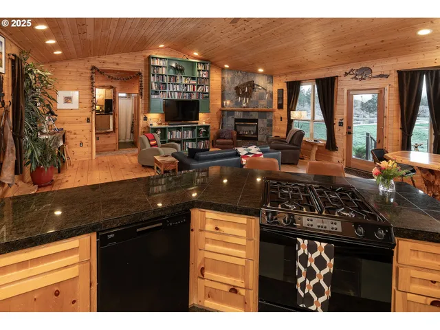 a bedroom with a bed next to a window