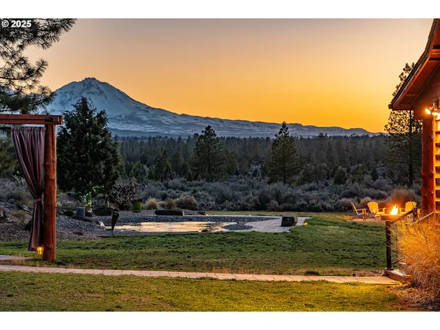 a view of a yard with an outdoor seating