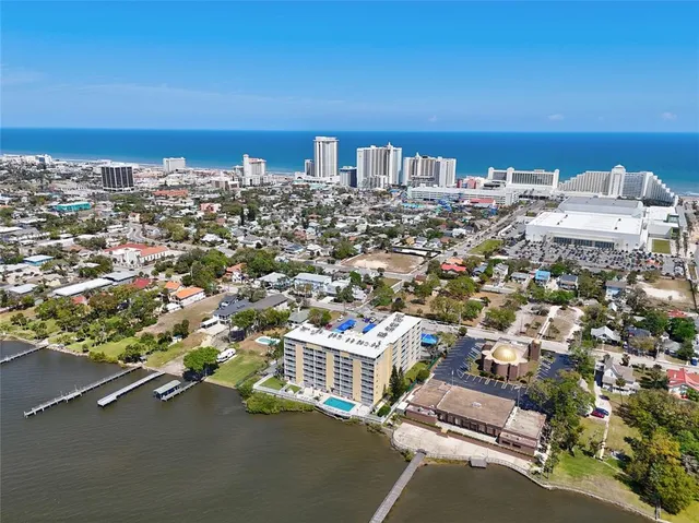 an aerial view of a city with ocean view