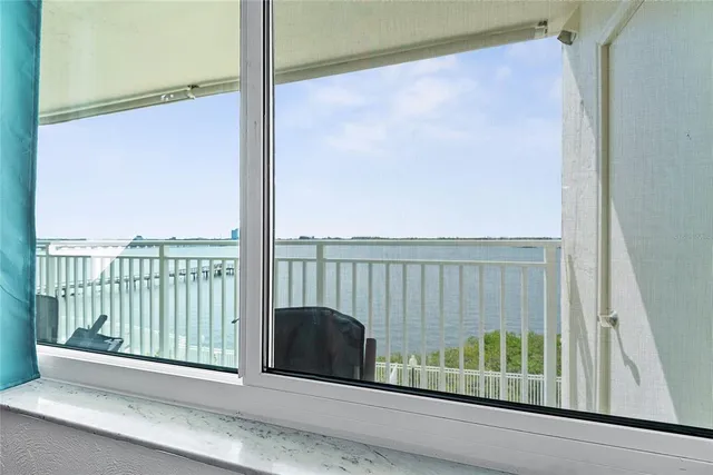 a view of a balcony with a floor to ceiling window