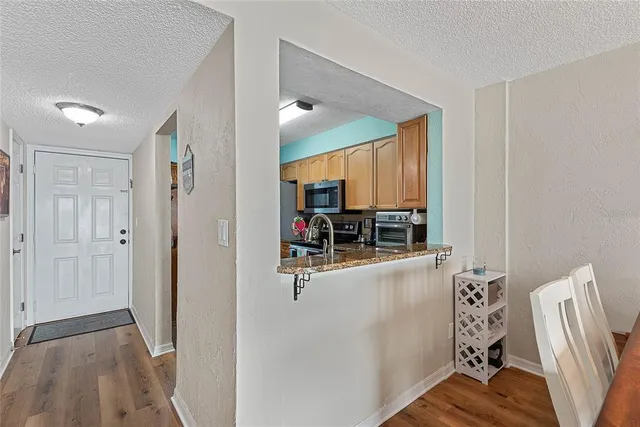 a view of living room filled with furniture and wooden floor