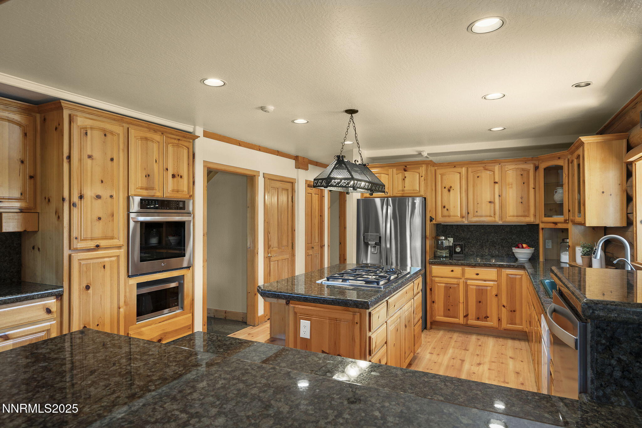 4684 Old Clear Creek Road Carson City, NV 89705 - Photo 22 of 46 a kitchen with stainless steel appliances granite countertop a sink stove and refrigerator