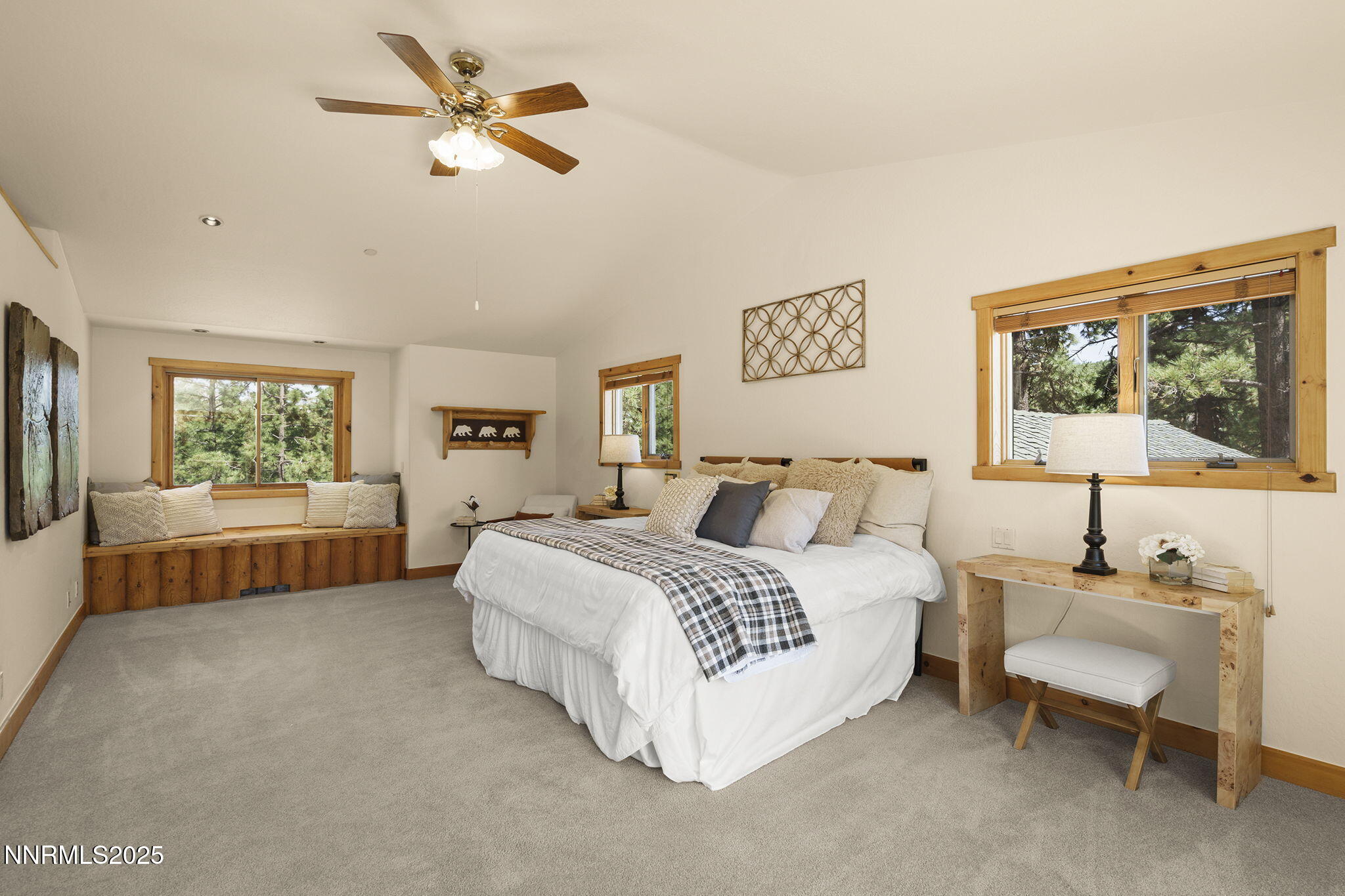 4684 Old Clear Creek Road Carson City, NV 89705 - Photo 24 of 46 a spacious bedroom with a bed a couch and a window