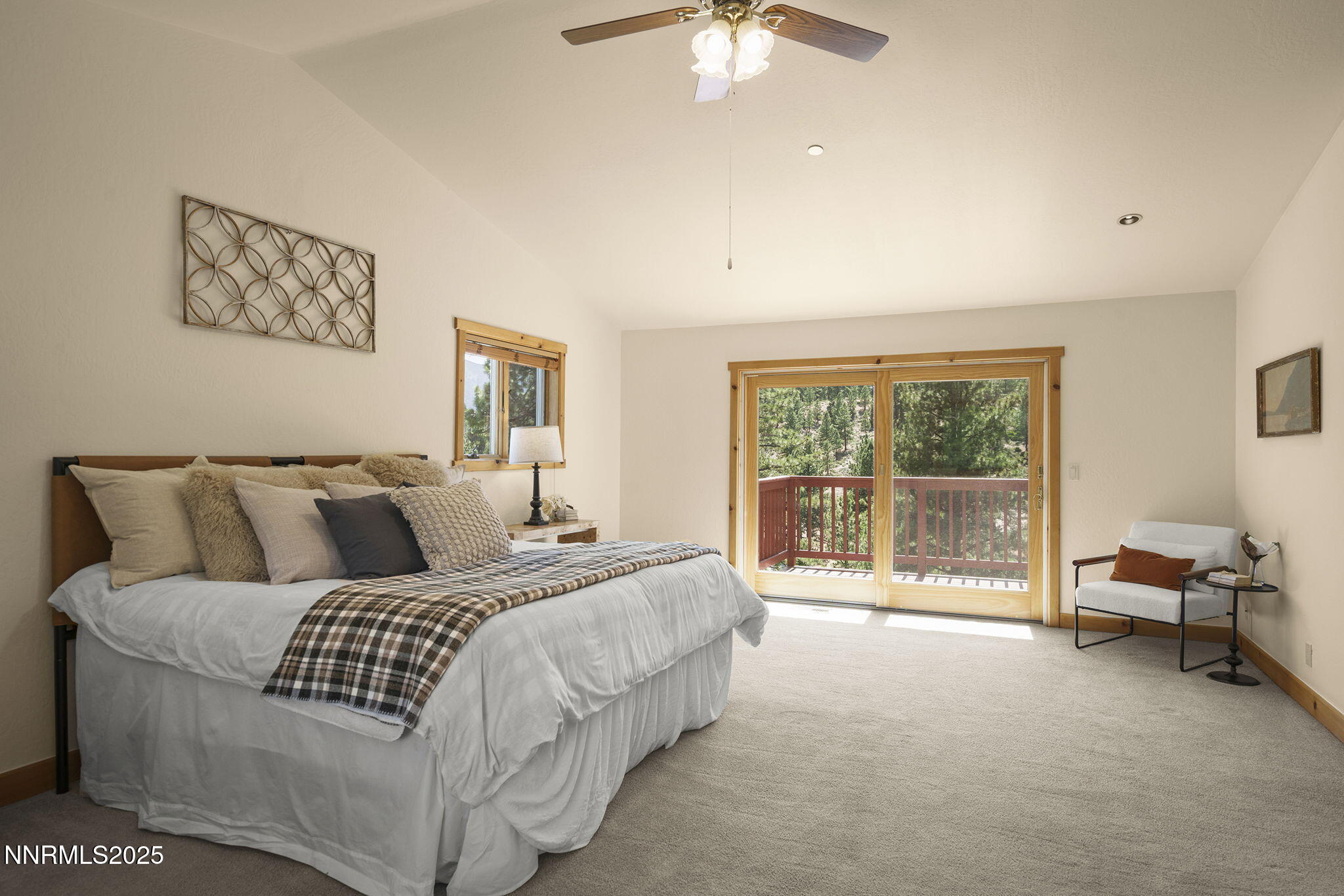 4684 Old Clear Creek Road Carson City, NV 89705 - Photo 26 of 46 a bedroom with a large bed and a chandelier