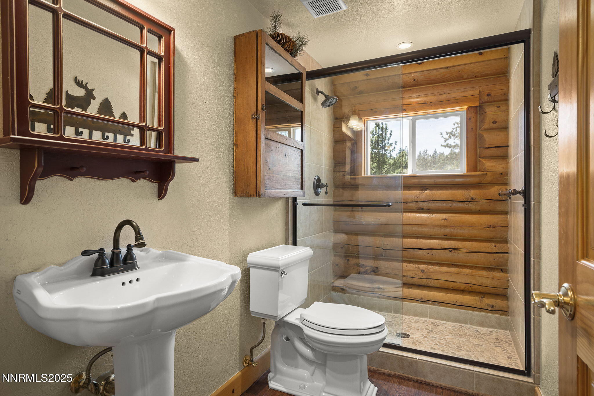 4684 Old Clear Creek Road Carson City, NV 89705 - Photo 34 of 46 a bathroom with a toilet a sink and mirror