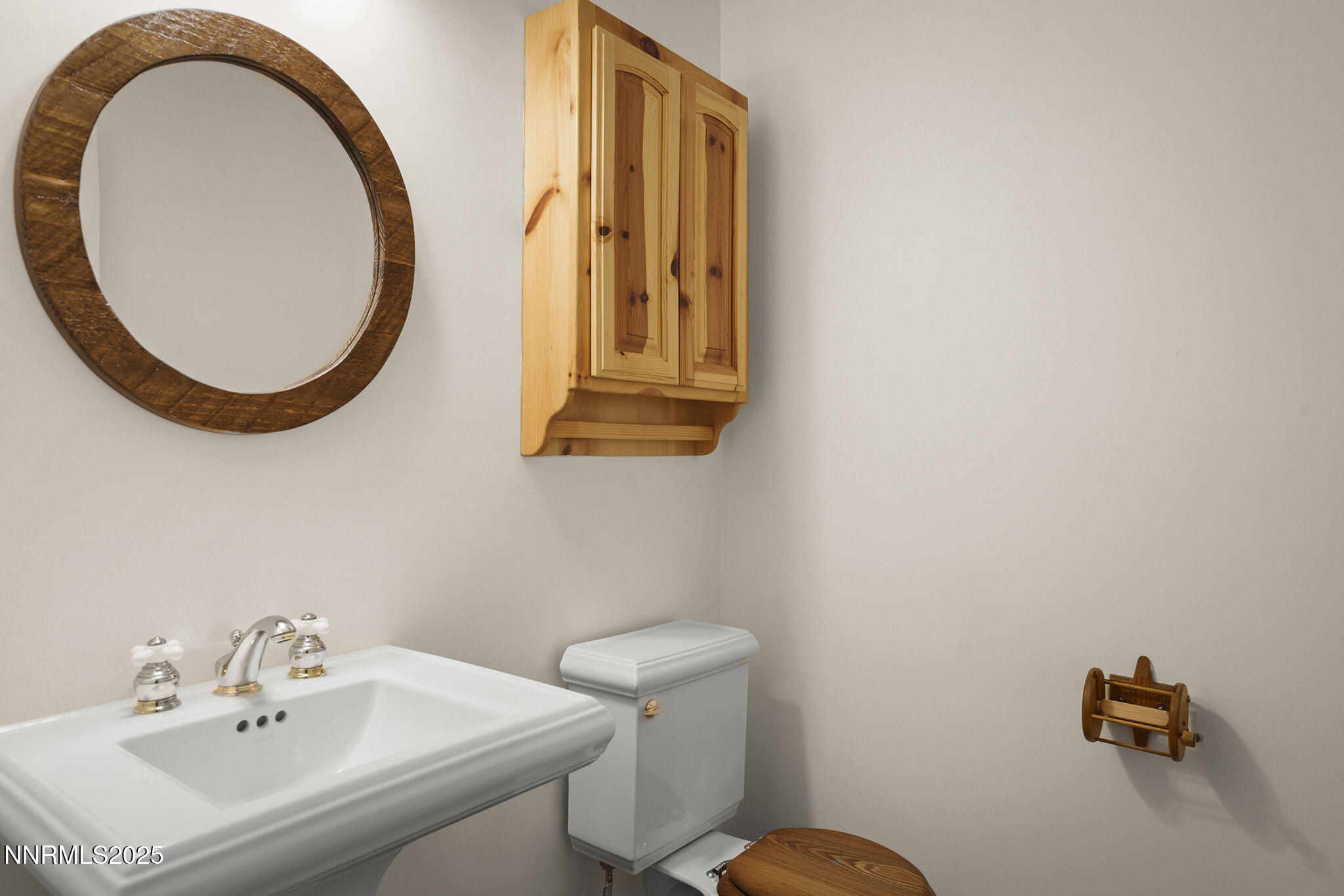 4684 Old Clear Creek Road Carson City, NV 89705 - Photo 36 of 46 a bathroom with a sink a mirror and a toilet