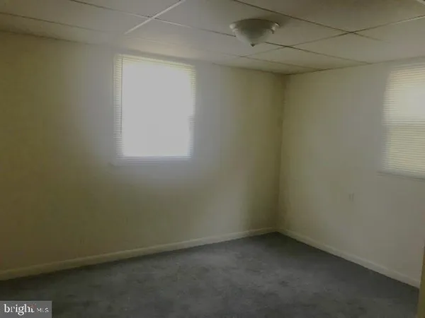a workspace with furniture and a window