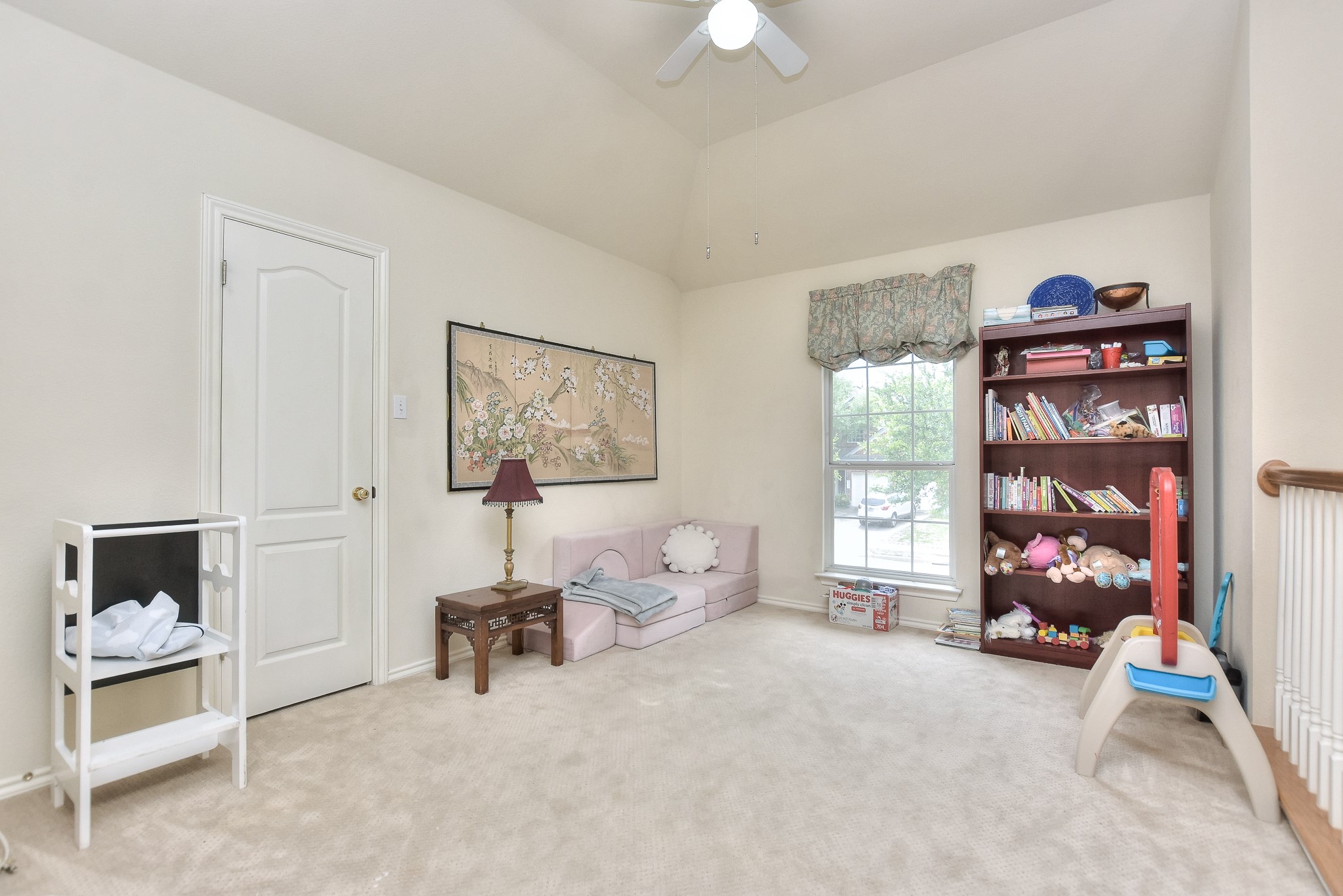 1609 Colton Way Cedar Park, TX 78613 - Photo 10 of 24 A versatile bonus room features a vaulted ceiling and ample natural light, ideal for diverse activities.