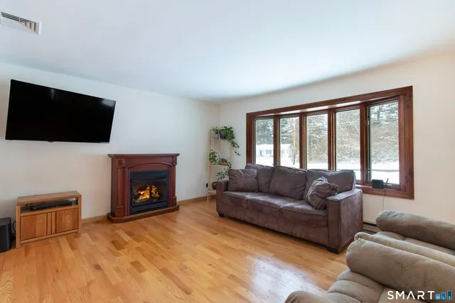 a kitchen with stainless steel appliances a refrigerator sink and microwave