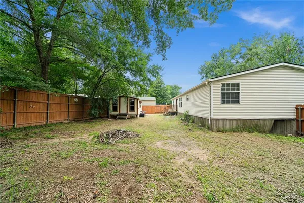 a house with trees in the background