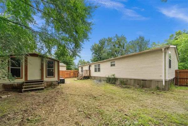 a view of room with wooden floor