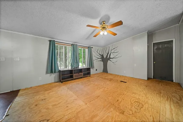 a kitchen with stainless steel appliances granite countertop wooden cabinets a sink and dishwasher a refrigerator with wooden floor