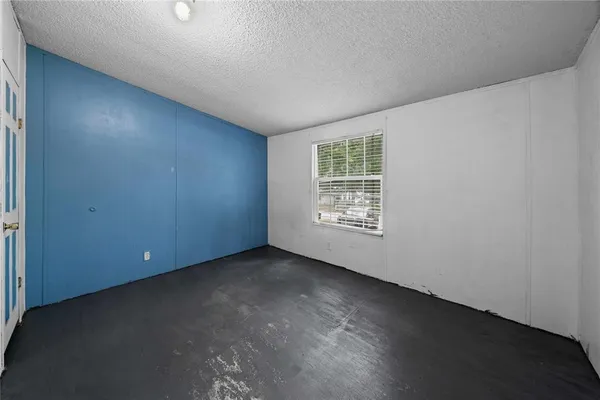 an empty room with entrance door