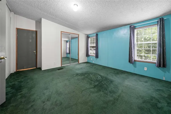 a large bathroom with a tub shower and sink