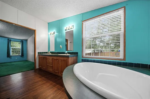 a view of a lake with houses in the back