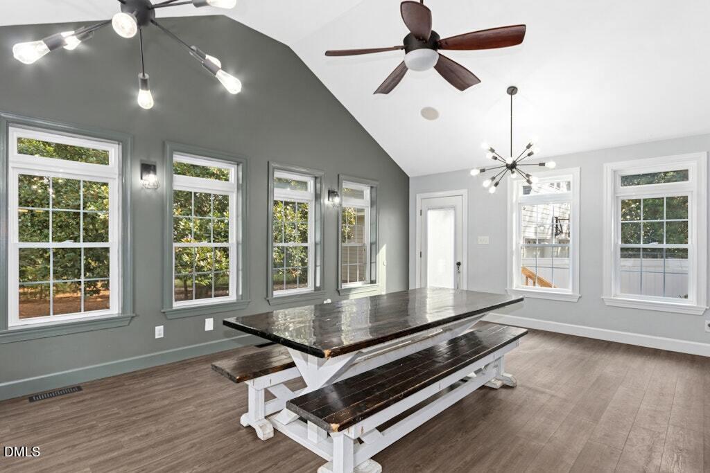 106 Village Court Garner, NC 27529 - Photo 8 of 38 a room with wooden floor and windows