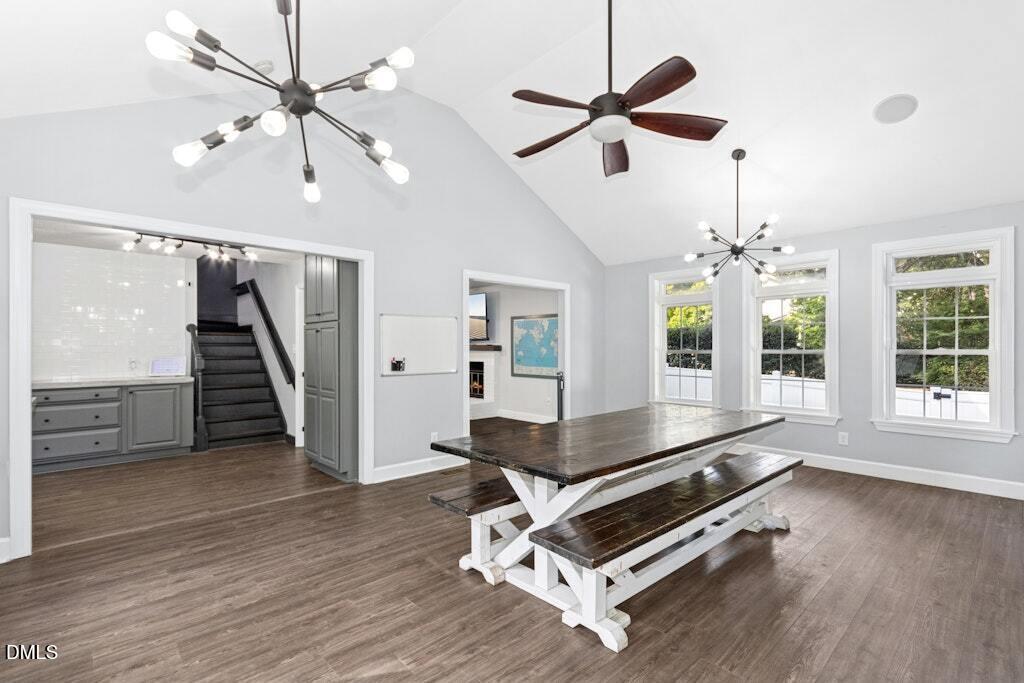 106 Village Court Garner, NC 27529 - Photo 10 of 38 a living room with wooden floor furniture and a ceiling fan