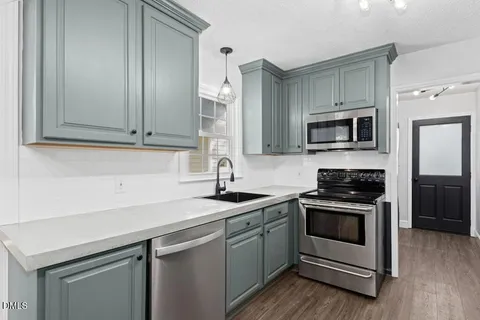 a room with wooden floor and windows