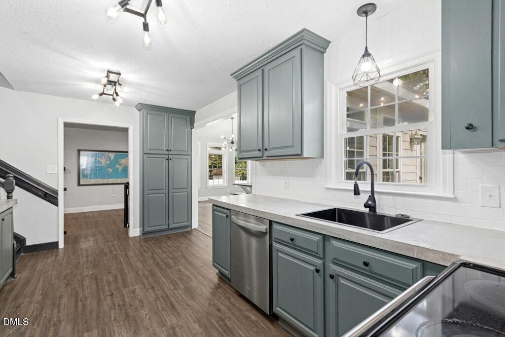 106 Village Court Garner, NC 27529 - Photo 13 of 38 a kitchen that has a sink cabinets and a wooden floor