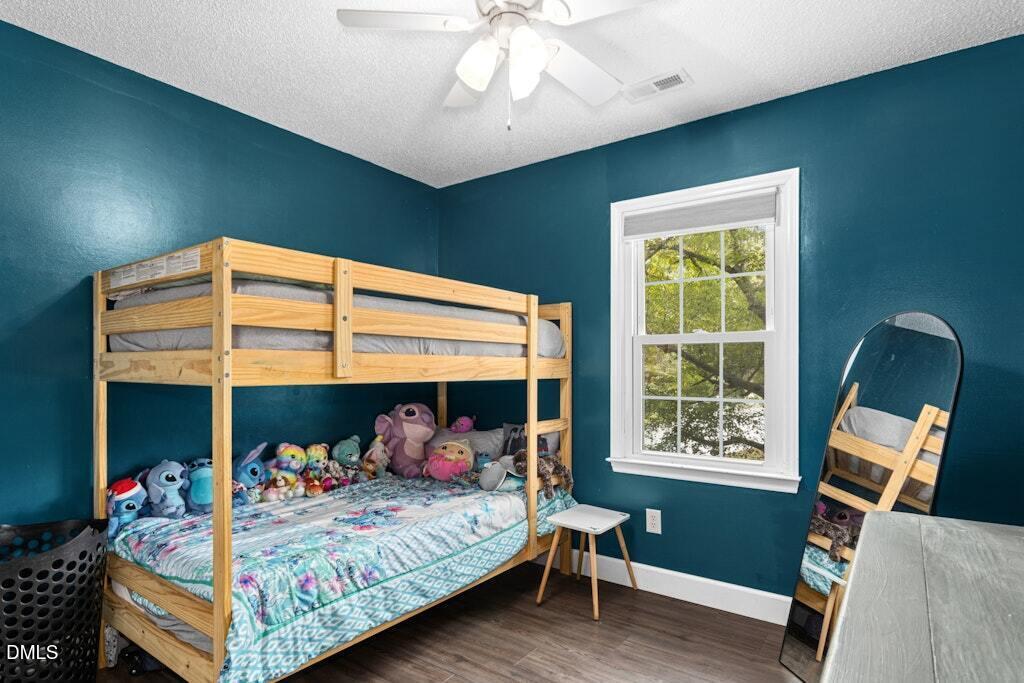 106 Village Court Garner, NC 27529 - Photo 21 of 38 a bed room with furniture and a window