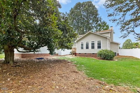a view of backyard with large trees
