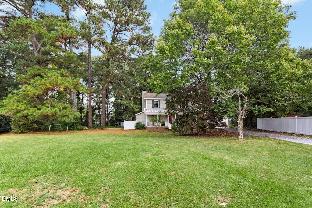 106 Village Court Garner, NC 27529 - Photo 29 of 38 a view of a tree in front of a house