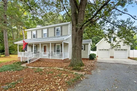 a front view of a house with a porch