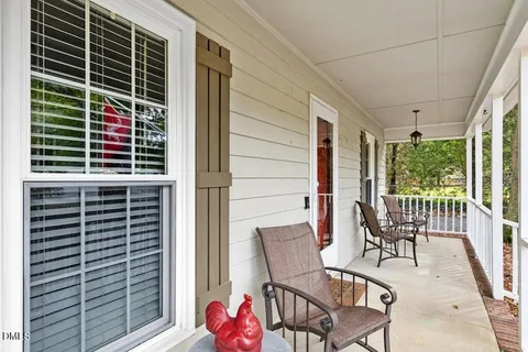 a picture of a bench in front of a wall